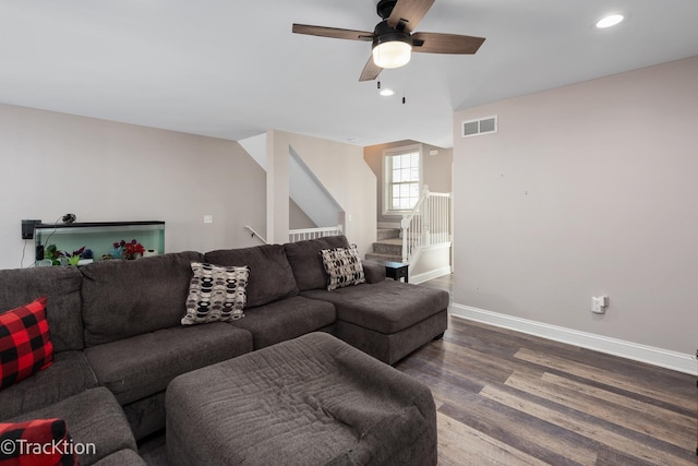 living room featuring ceiling fan and hardwood / wood-style floors