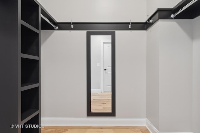 walk in closet featuring hardwood / wood-style floors