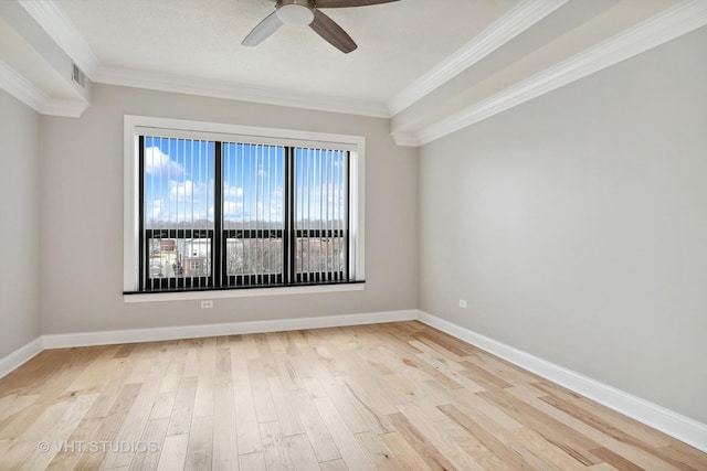 spare room featuring crown molding, ceiling fan, and light hardwood / wood-style floors