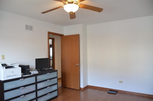 bedroom with dark hardwood / wood-style floors