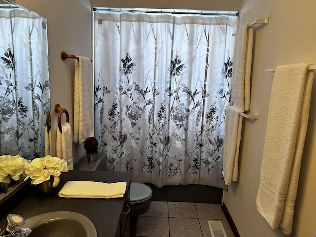 full bathroom with sink, shower / bathtub combination with curtain, tile patterned floors, and toilet