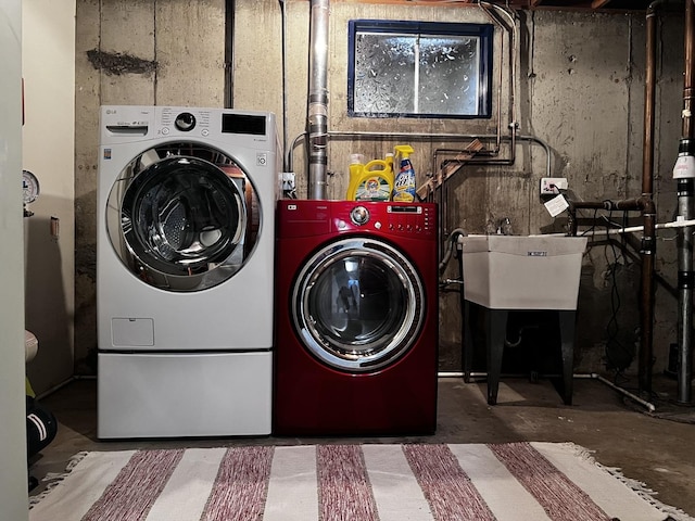 laundry area with sink and independent washer and dryer