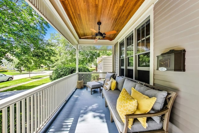 balcony featuring ceiling fan and covered porch