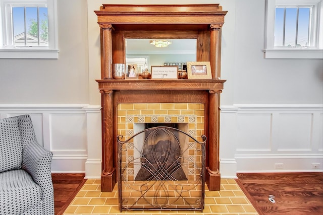 interior details with a tile fireplace