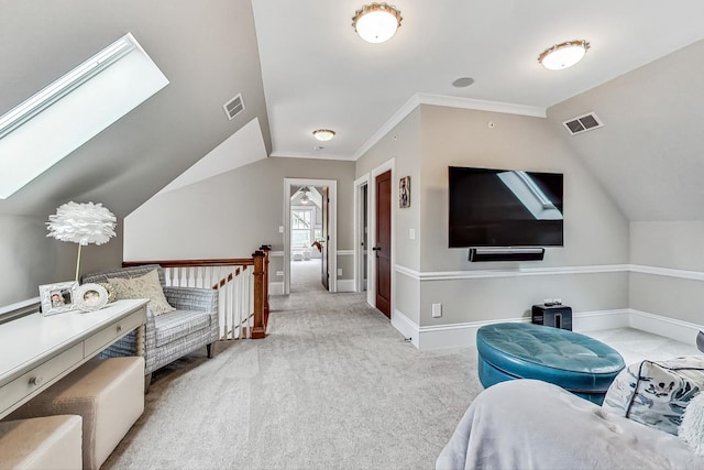 interior space with lofted ceiling with skylight and crown molding