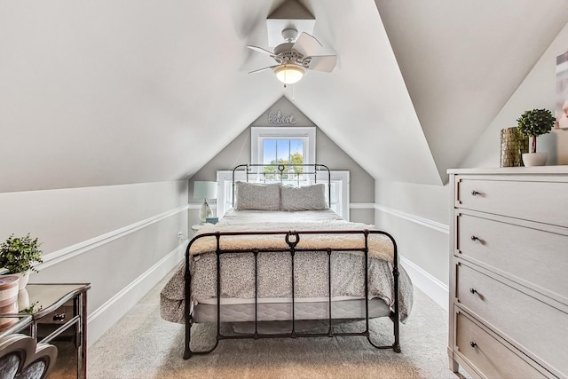 bedroom featuring ceiling fan, carpet flooring, and lofted ceiling