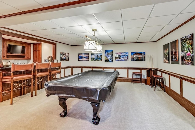 rec room with light carpet, indoor bar, a drop ceiling, and billiards