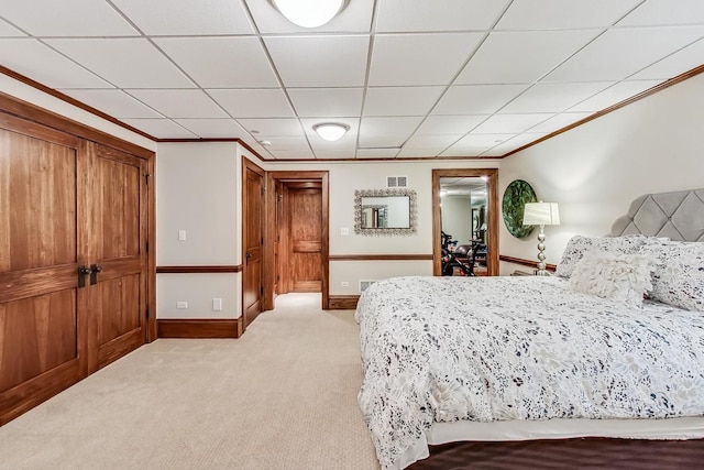 carpeted bedroom with crown molding