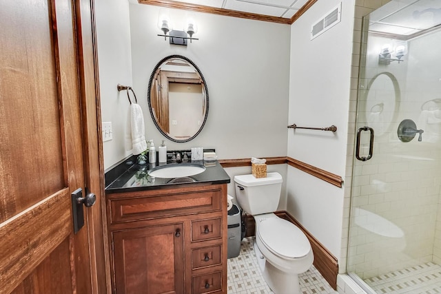 bathroom with toilet, crown molding, a shower with shower door, and vanity