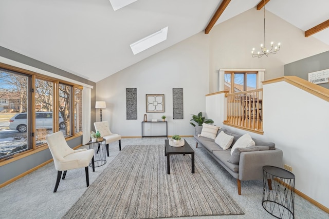 carpeted living room with beam ceiling, a wealth of natural light, a skylight, and a chandelier