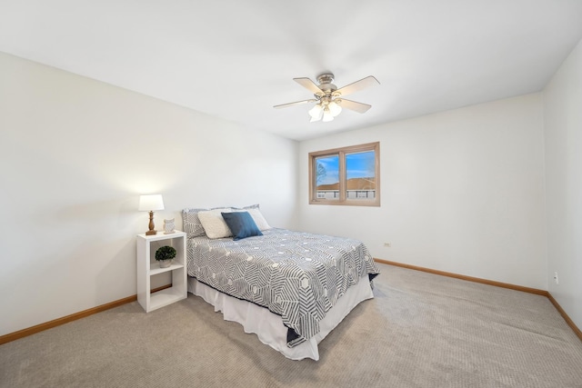 bedroom featuring light colored carpet and ceiling fan