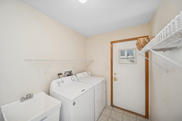 laundry area featuring sink and washer and dryer