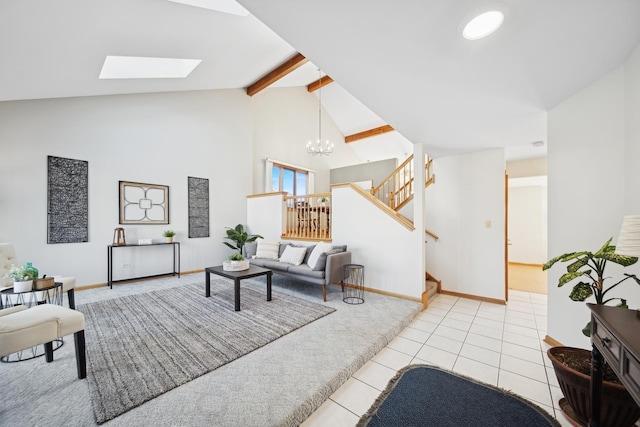 living room with light tile patterned floors, beam ceiling, a skylight, high vaulted ceiling, and a chandelier