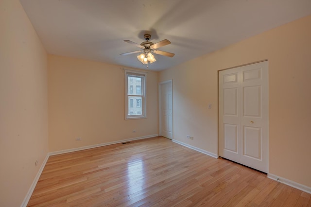 unfurnished bedroom featuring ceiling fan and light hardwood / wood-style flooring