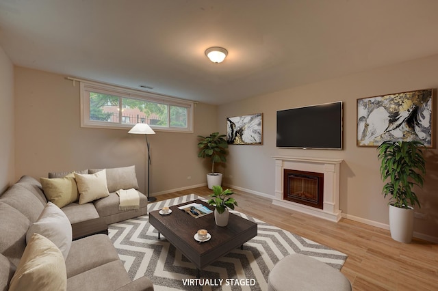 living room with light hardwood / wood-style floors