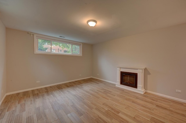 unfurnished living room with light hardwood / wood-style floors