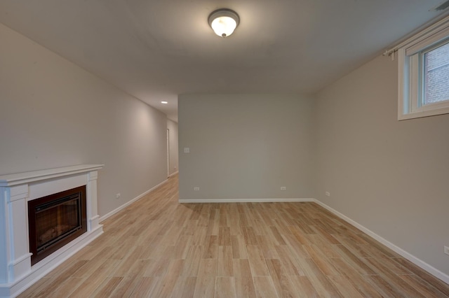 unfurnished living room with light wood-type flooring