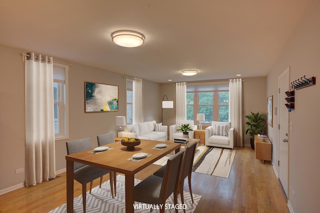 dining space featuring light hardwood / wood-style flooring