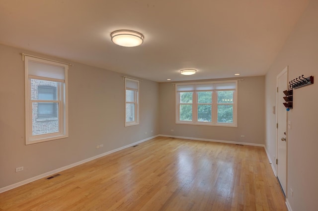 unfurnished room featuring light hardwood / wood-style floors