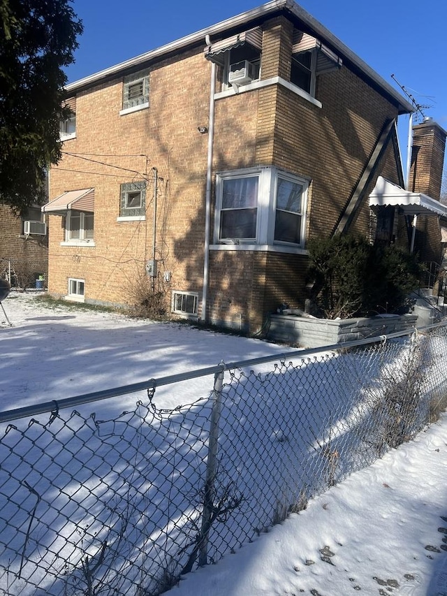 view of snow covered house