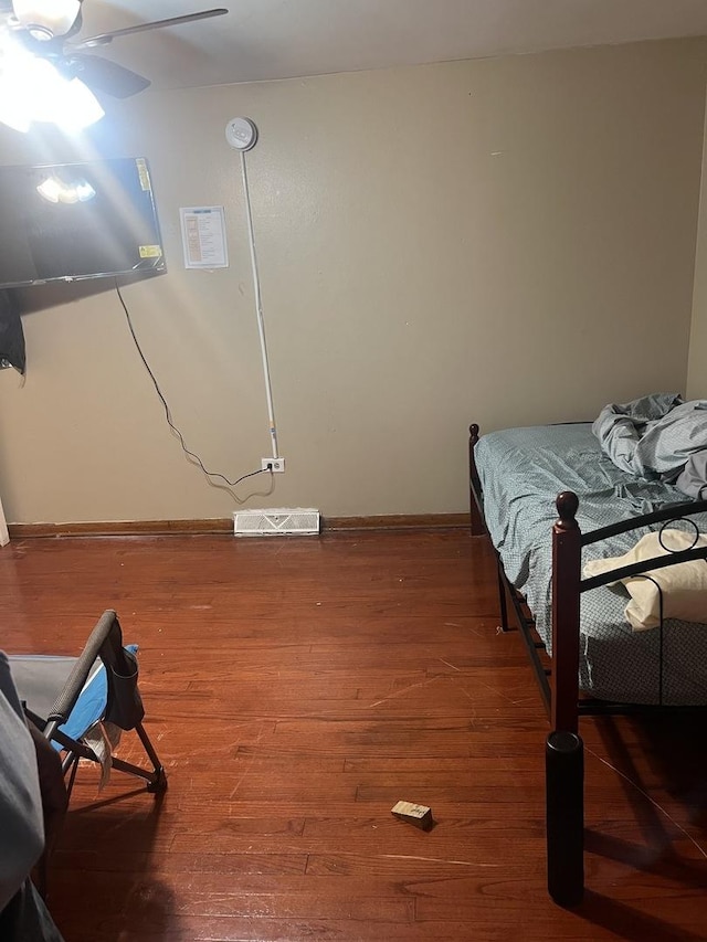 bedroom featuring ceiling fan and wood-type flooring