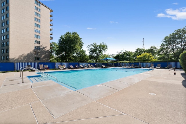 view of swimming pool featuring a patio area