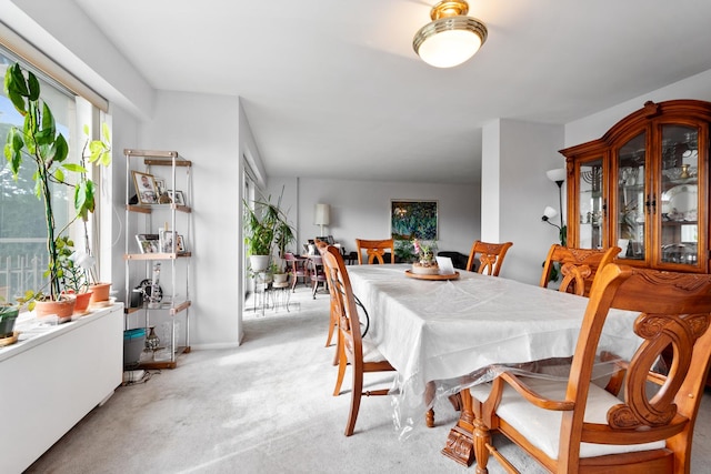 dining space with light carpet