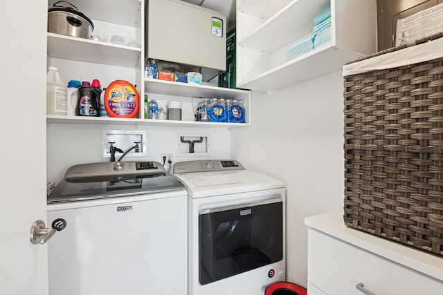 clothes washing area featuring washing machine and dryer