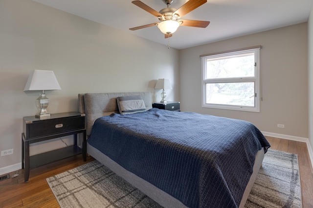 bedroom featuring hardwood / wood-style flooring and ceiling fan