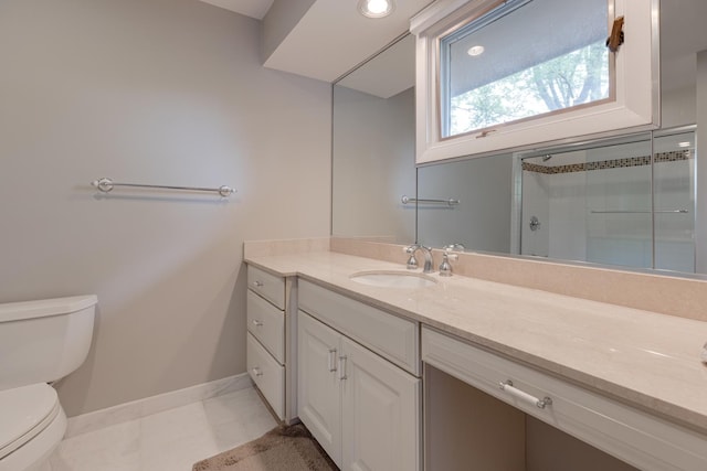 bathroom featuring walk in shower, vanity, toilet, and tile patterned flooring