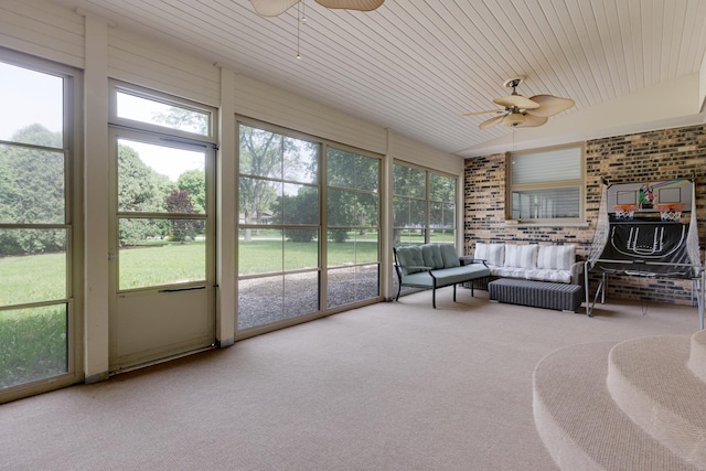 sunroom / solarium with lofted ceiling, wood ceiling, and ceiling fan