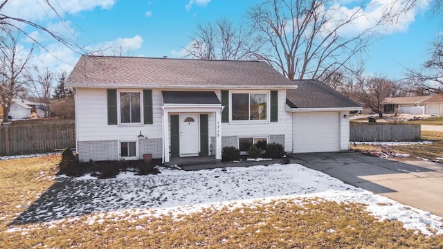 raised ranch featuring a garage