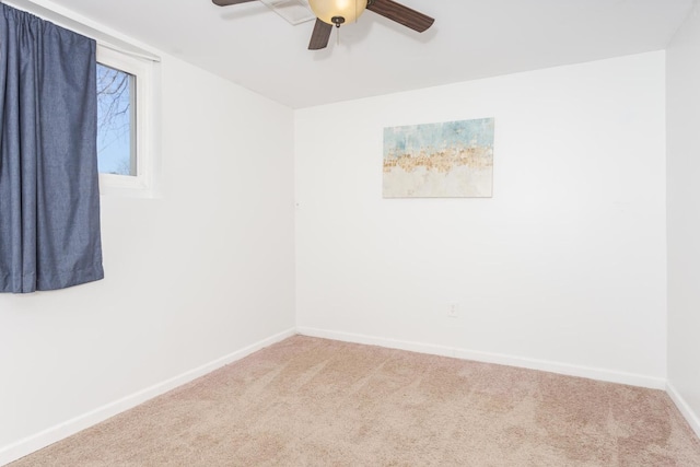 spare room featuring carpet and ceiling fan