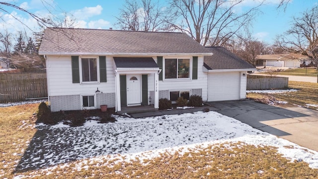 bi-level home featuring a garage