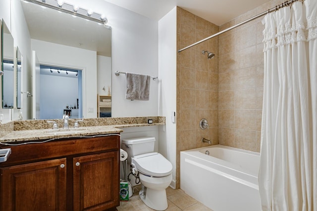 full bathroom featuring toilet, tile patterned floors, vanity, and shower / tub combo with curtain