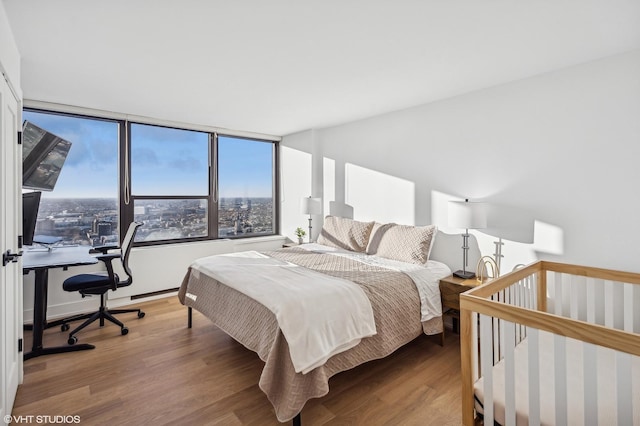 bedroom featuring hardwood / wood-style floors