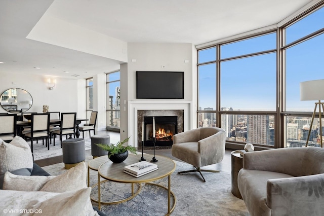 living room with plenty of natural light and a wall of windows