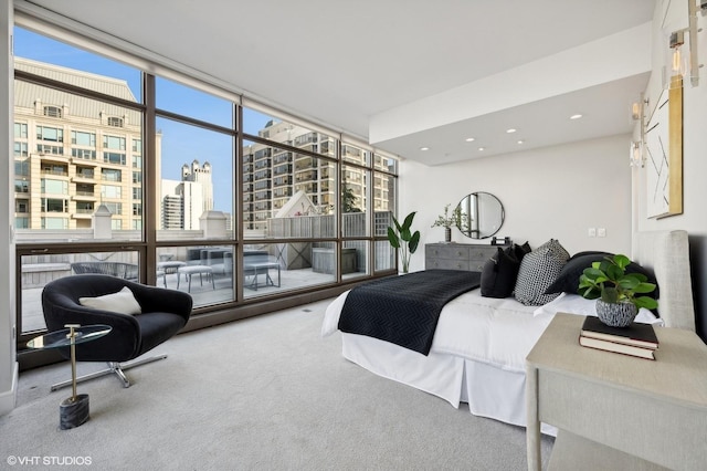 carpeted bedroom with expansive windows