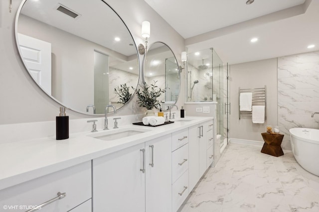 bathroom featuring tile walls, vanity, and shower with separate bathtub