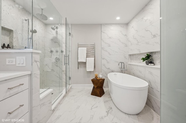 bathroom featuring radiator, shower with separate bathtub, and vanity