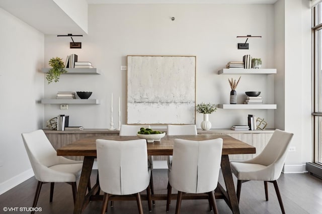 dining space with dark wood-type flooring