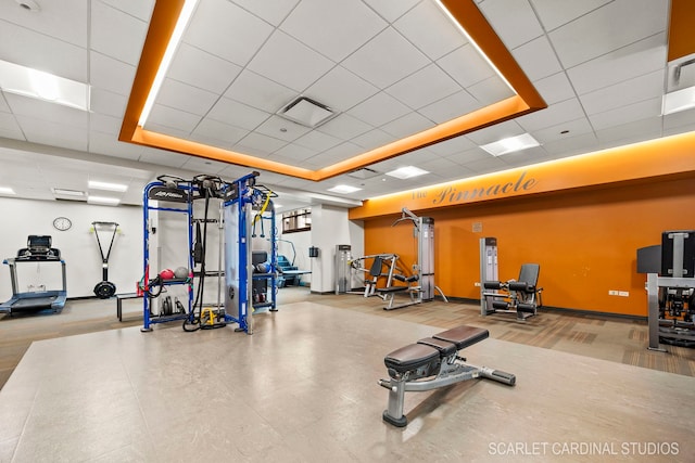 exercise room featuring a paneled ceiling