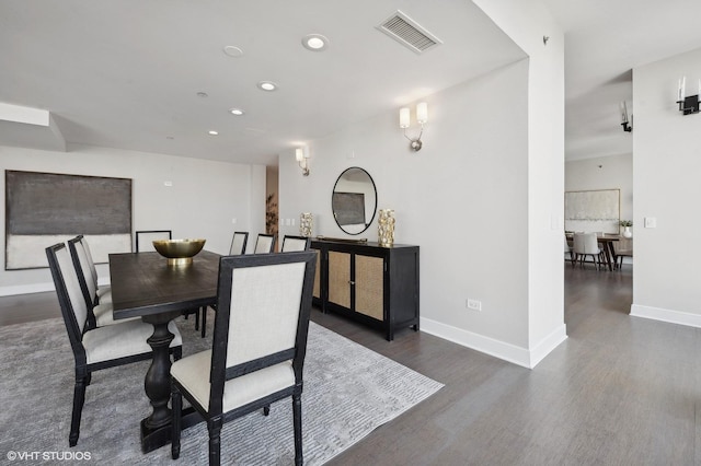 dining room with dark hardwood / wood-style floors