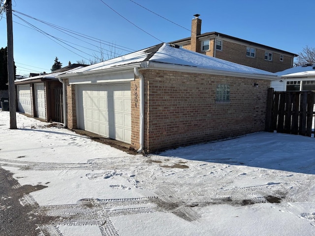 view of snow covered garage