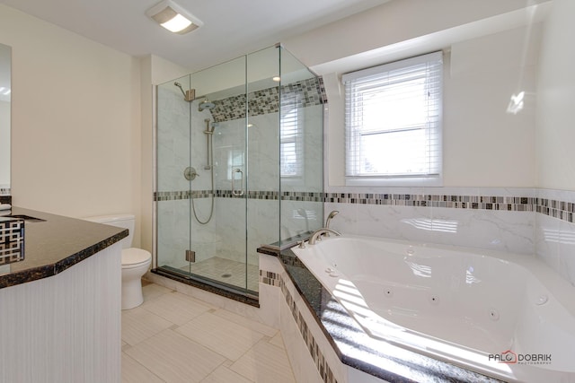 bathroom with tile patterned flooring, shower with separate bathtub, and toilet