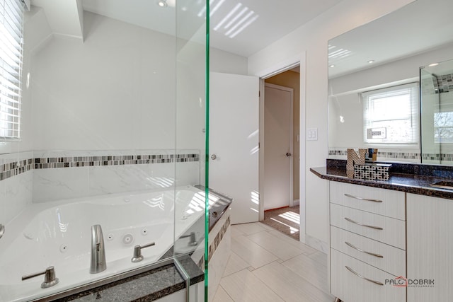 bathroom with vanity, tile patterned floors, and independent shower and bath