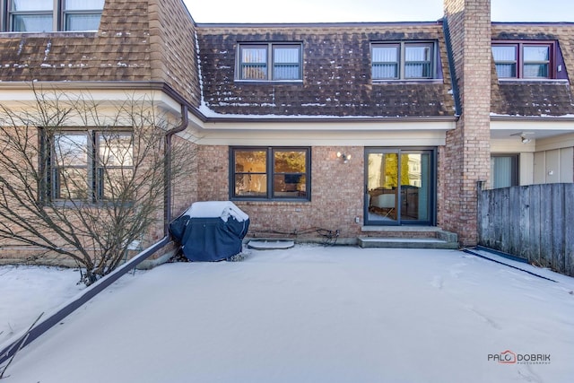 view of snow covered house