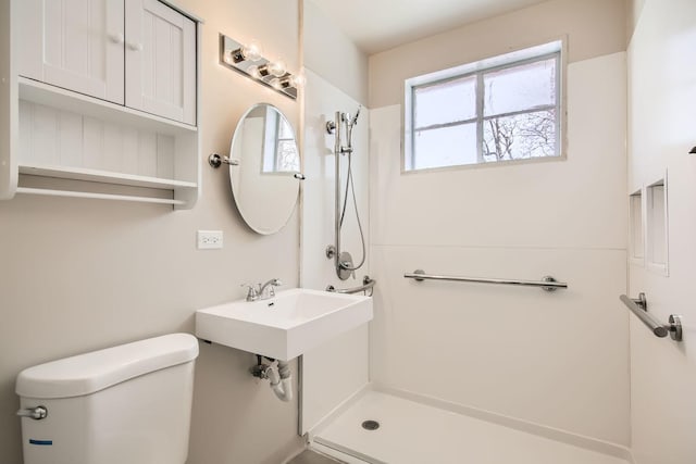 bathroom with toilet and walk in shower