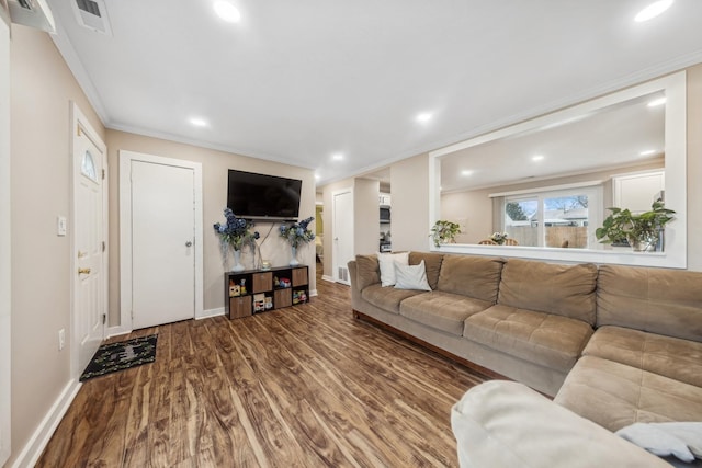 living room featuring ornamental molding and hardwood / wood-style flooring