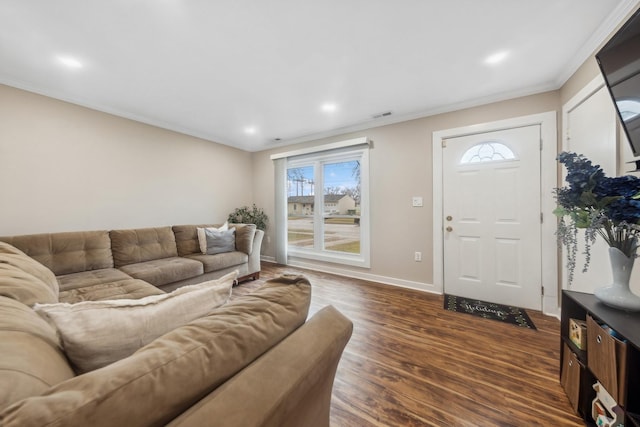 living room with dark wood-type flooring and crown molding